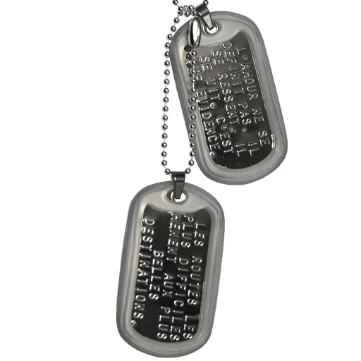 This ID Tag includes 2 Dog Tag military plates in ground steel (bright) with turned edges. They can be personalized by embossing (raised letters). They are set with a transparent silicone silencer and